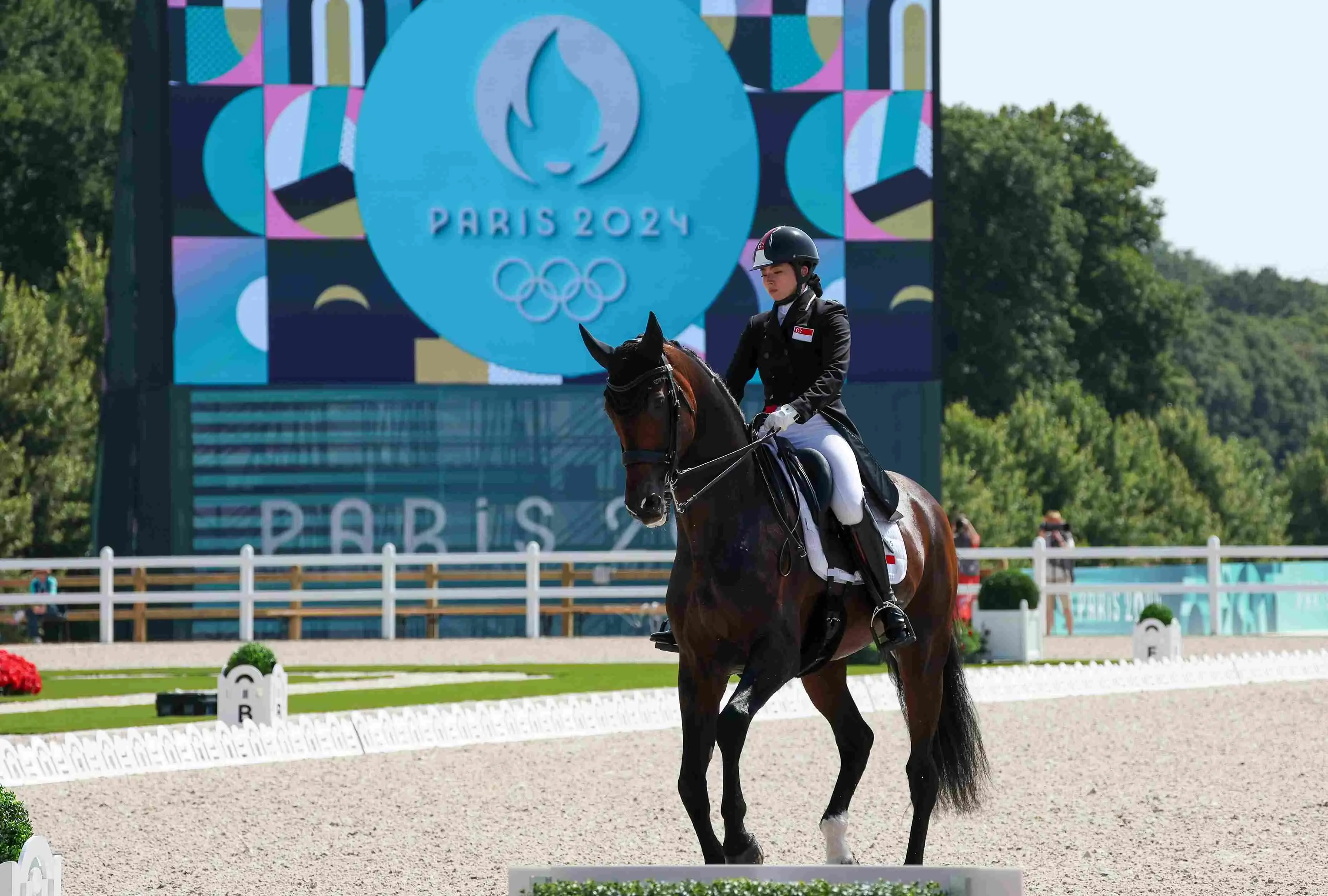 Caroline Chew rides her horse Zatchmo during their individual dressage grand prix performance at the 2024 Paris Games.  Photo: Sport Singapore/Jeremy Lee