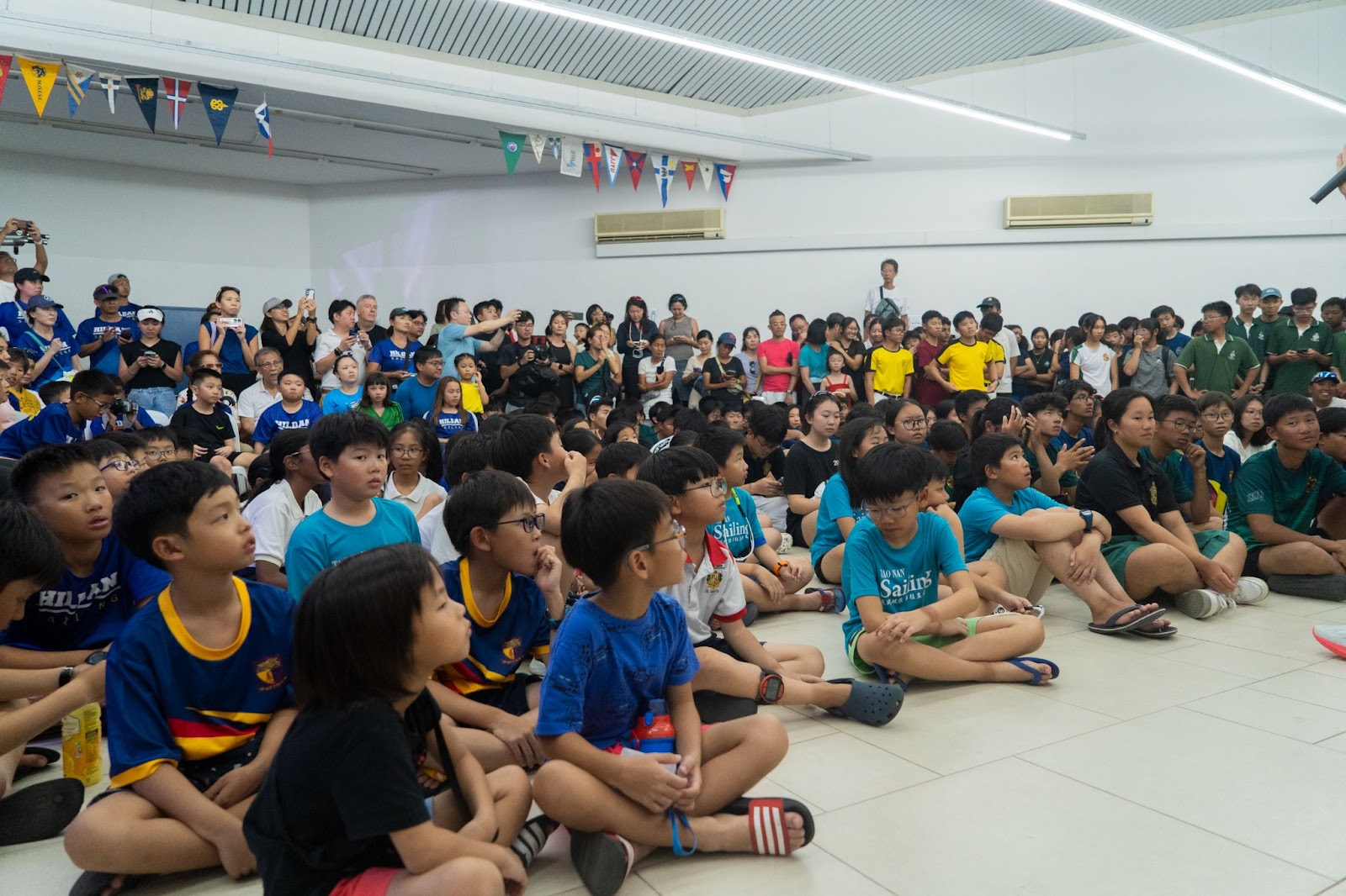 Anticipation fills the air as students and parents eagerly await the announcement of the sailing games