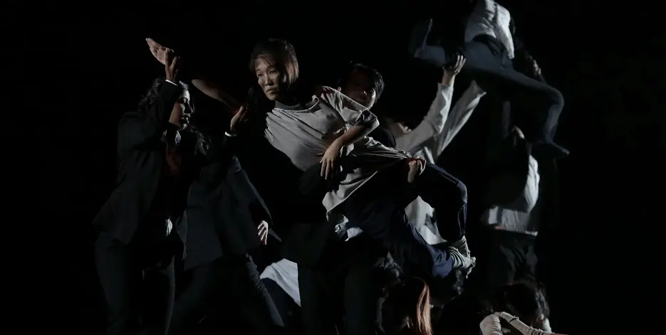 Girl in dance group being lifted up