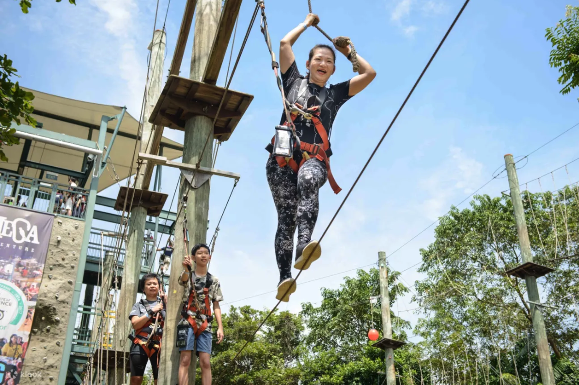Woman happily crossing an obstacle course
