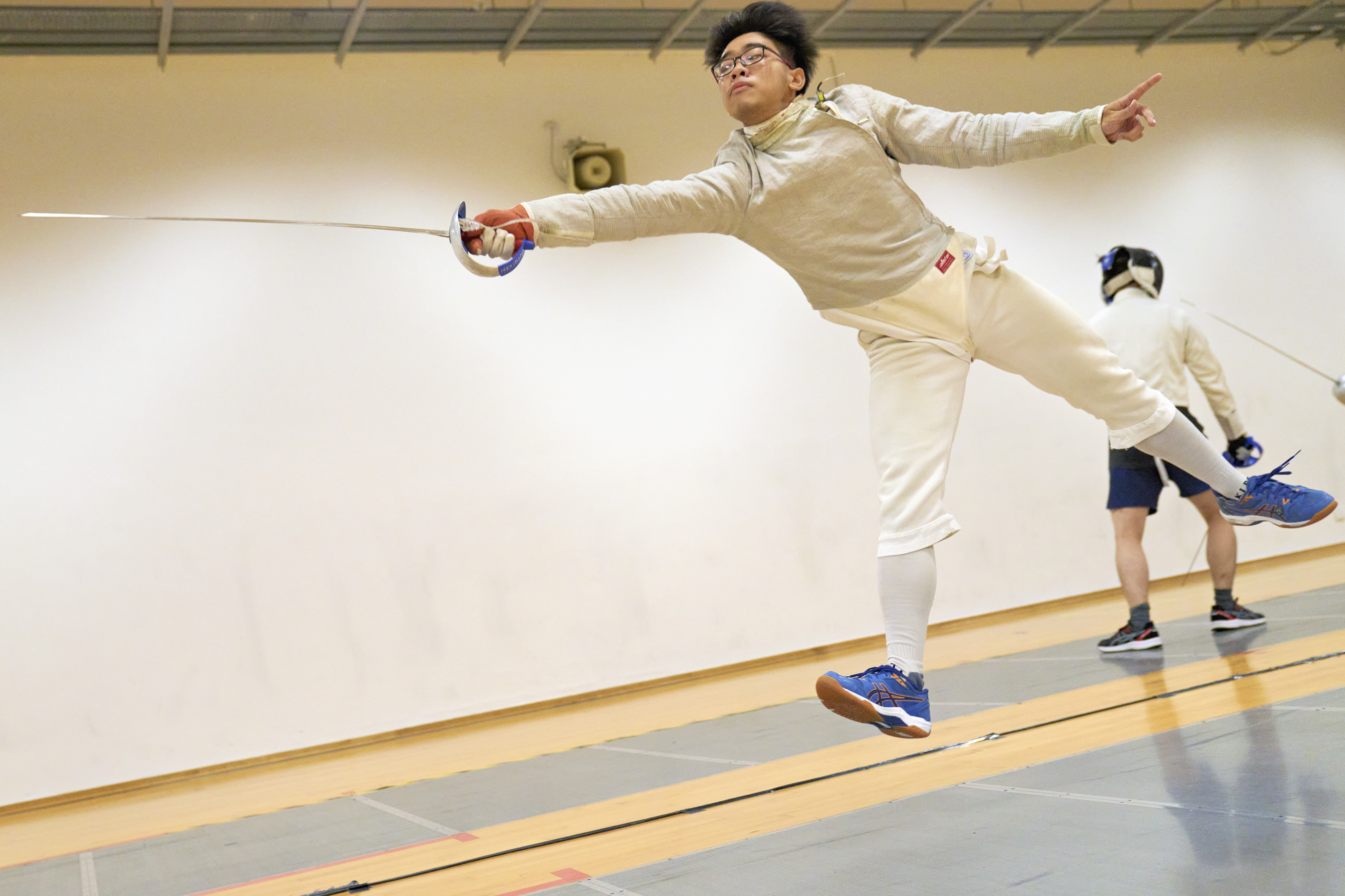 2023_04_20 Fencing Sabre A Div Boys Photo by Eric Koh, Fencer warms up before the match DSC07265