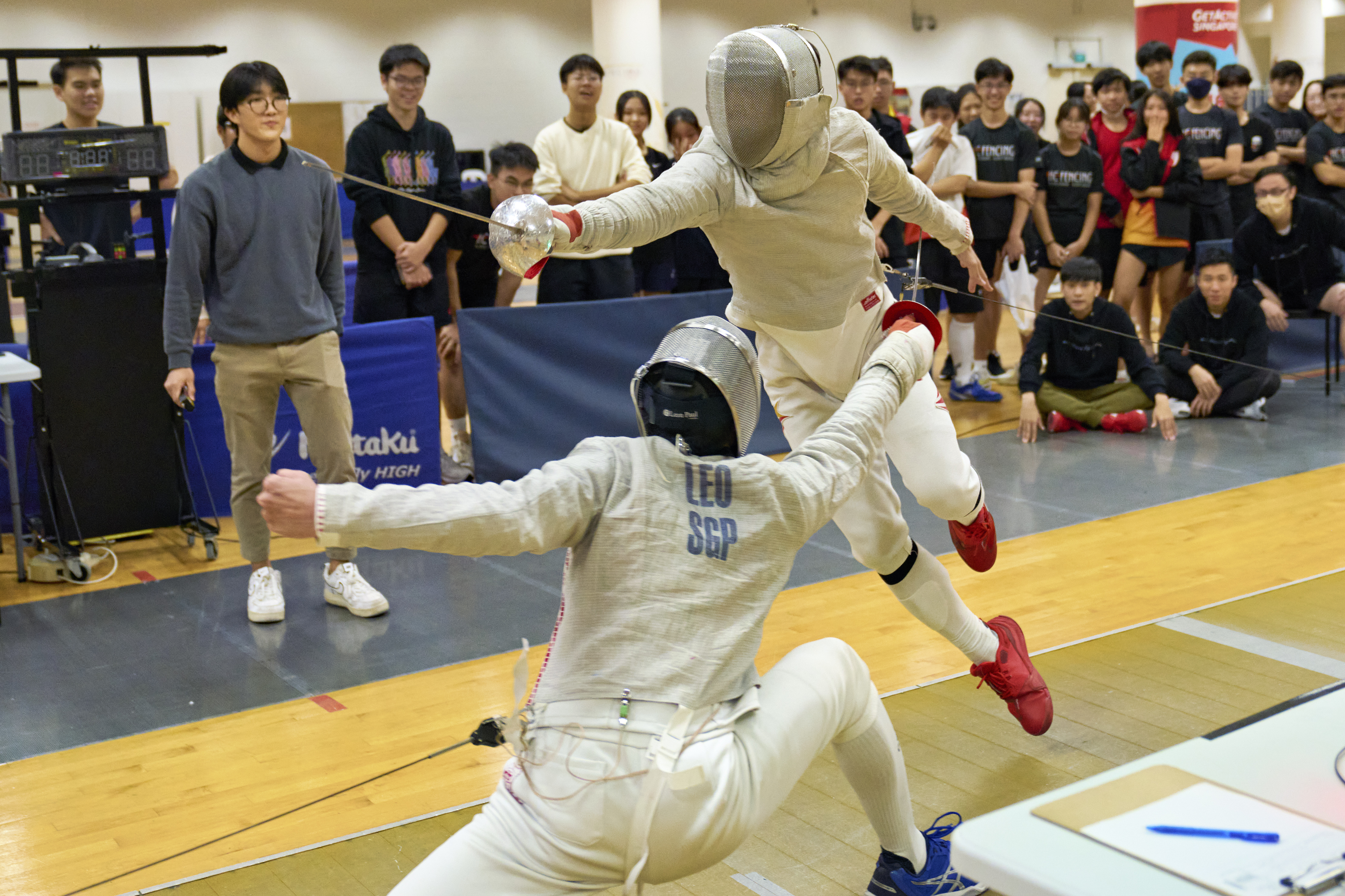 2023_04_20 Fencing Sabre A Div Boys Photo by Eric Koh, Fencers in action during the semi-final DSC09052