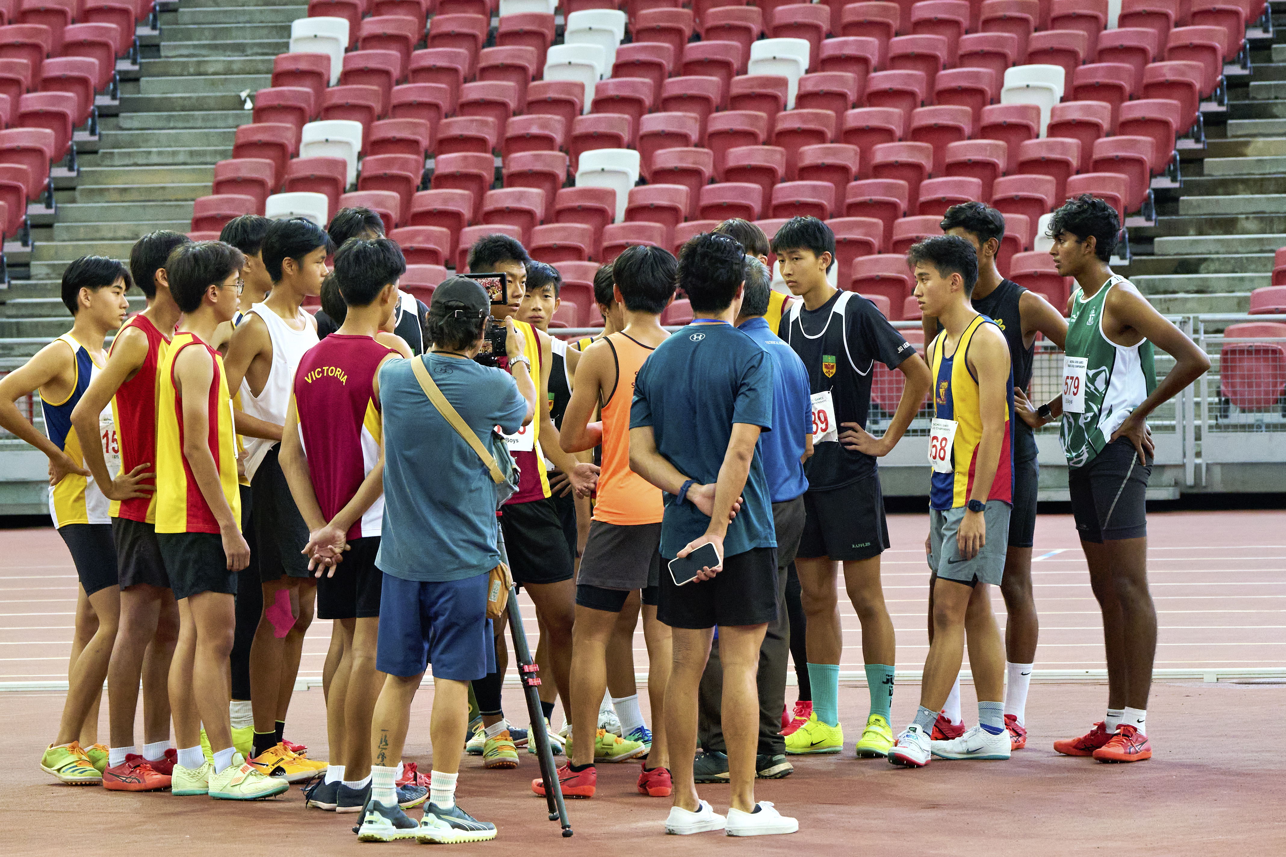 2023-04-28 NSG T&F Championships Photo by Eric Koh, Technical Official briefs the finalists before the start of High Jump B Div Boys competition DSC06012